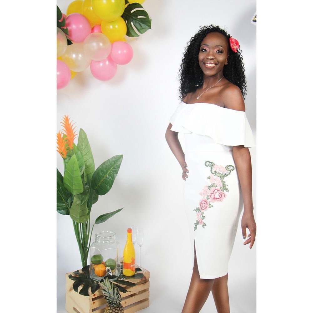 Off the shoulder dress w/pink flower accents.